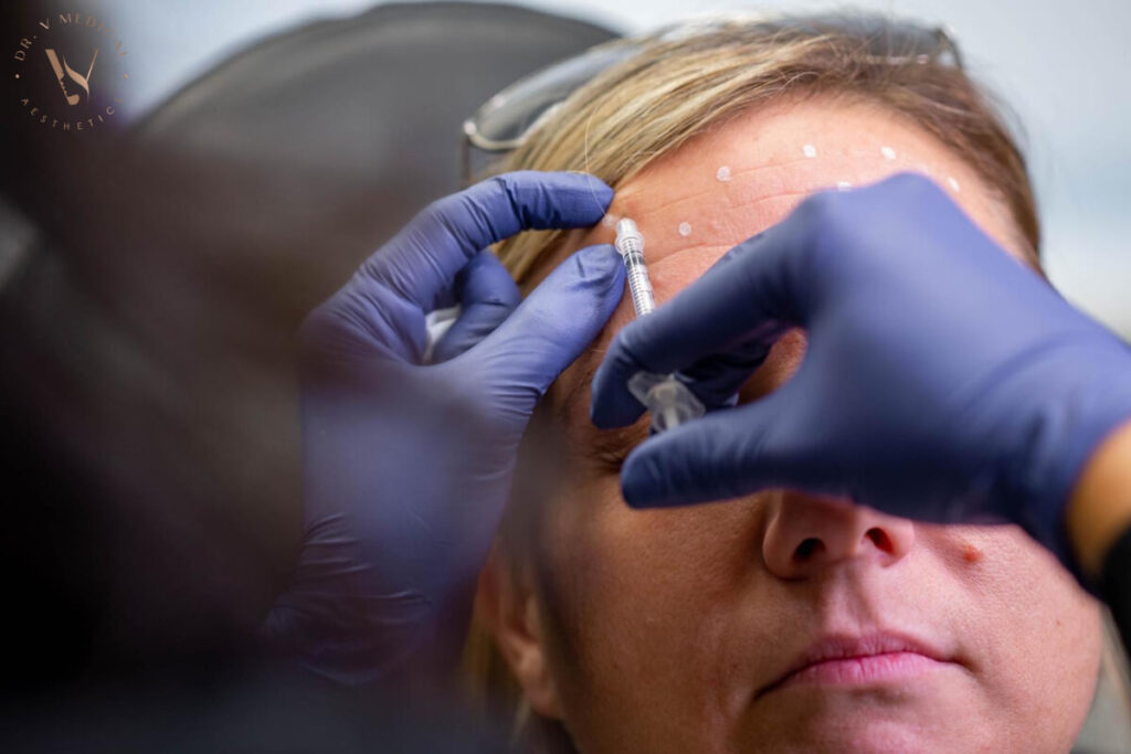 woman receiving botox to her forehead