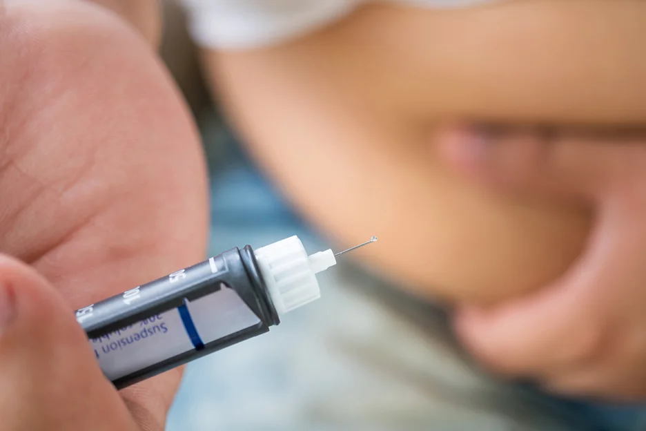 patient holding a semaglutide pen