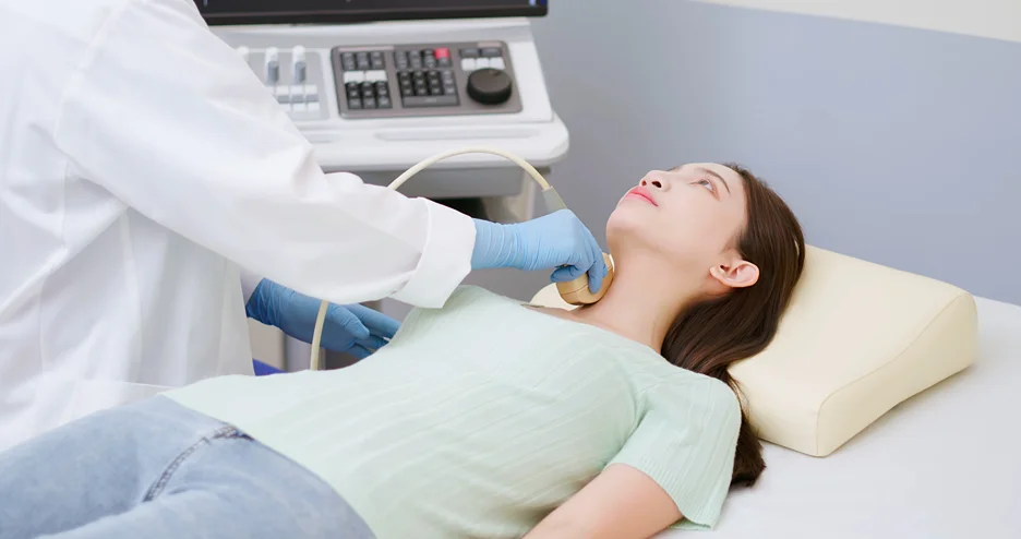 a patient undergoes ultrasound for thyroid cancer diagnosis