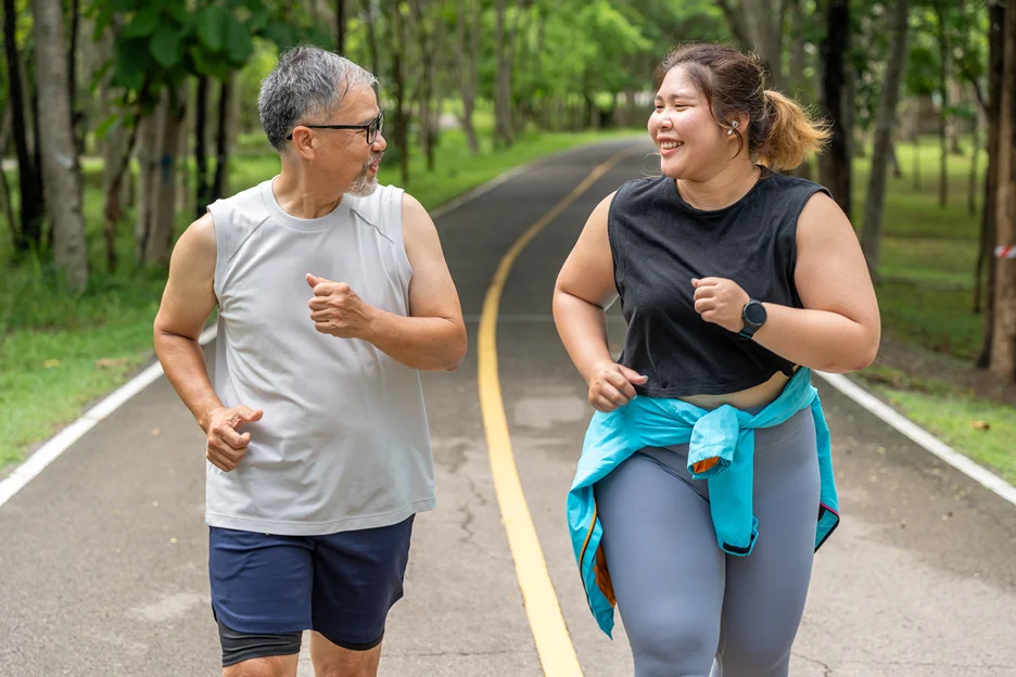 matured man and overweight woman went for a jog